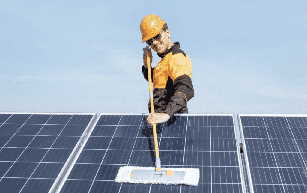 R&R Windows Cleaning & Maintenance worker cleaning Solar Panel